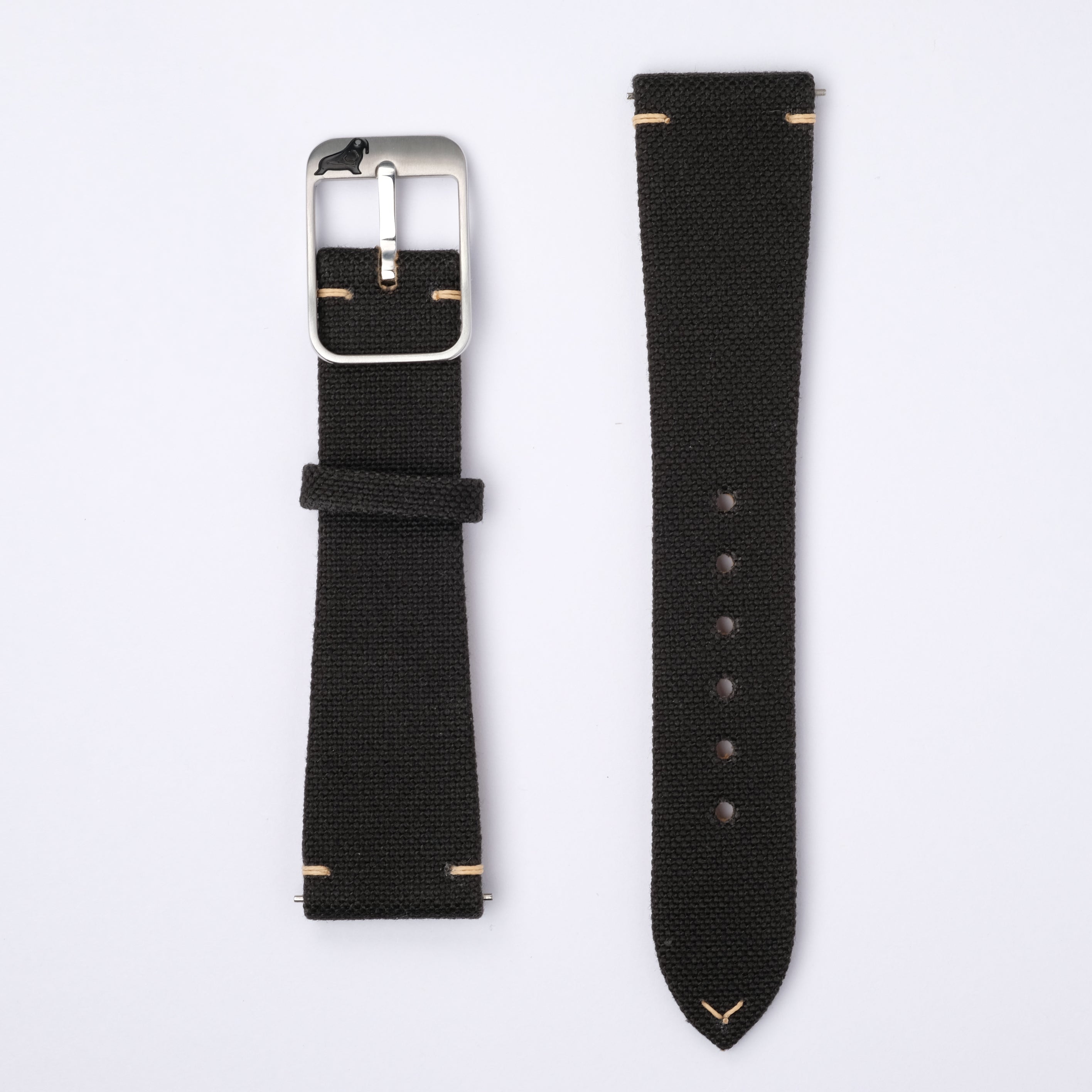 The Black Coal Fine Canvas watch strap by RSM Watch Strap, made from Japanese canvas, features a silver buckle, edge stitching, multiple adjustment holes, and quick-release spring bars.