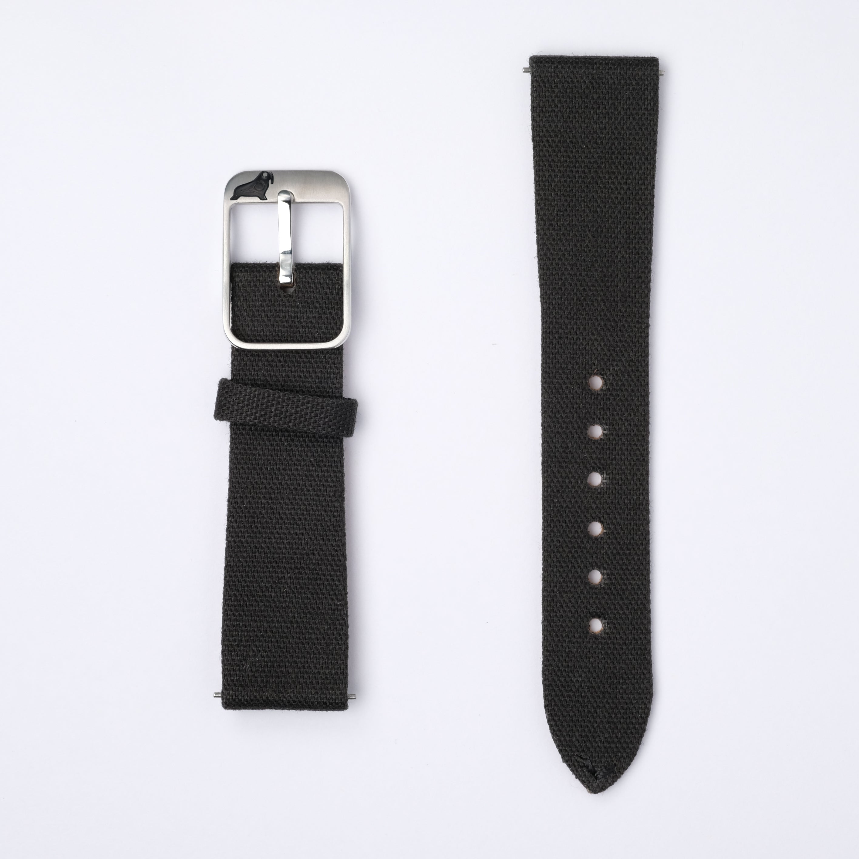Two black fabric watch straps from RSM Watch Strap on a white background. Left: Fine Canvas watch strap in black coal with a silver buckle. Right: Quick-release spring bars and multiple adjustment holes for comfort.