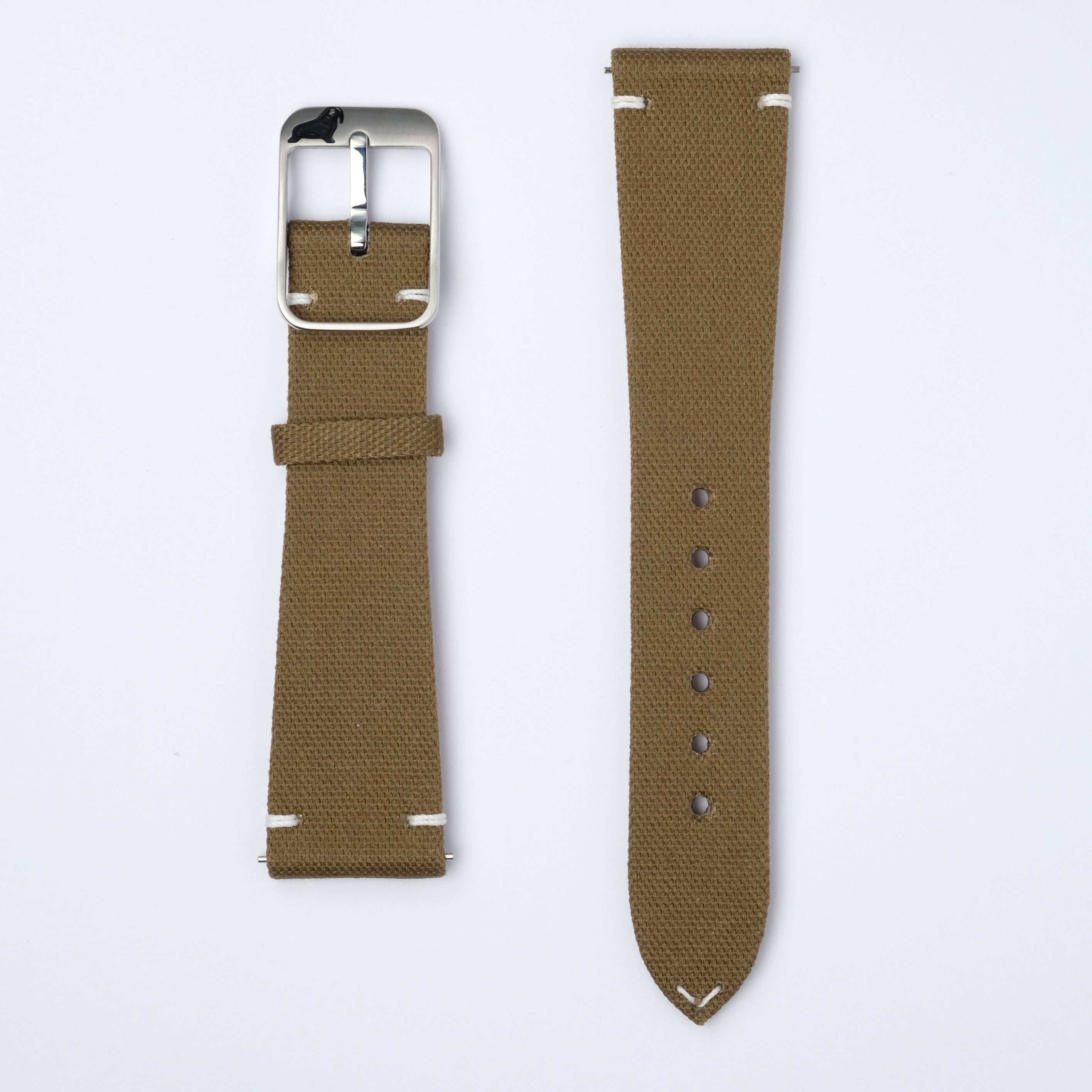 Two Pine Khaki Fine Canvas Straps by RSM rest on a white background. One has sizing holes, the other a silver-tone buckle, both with white stitching.