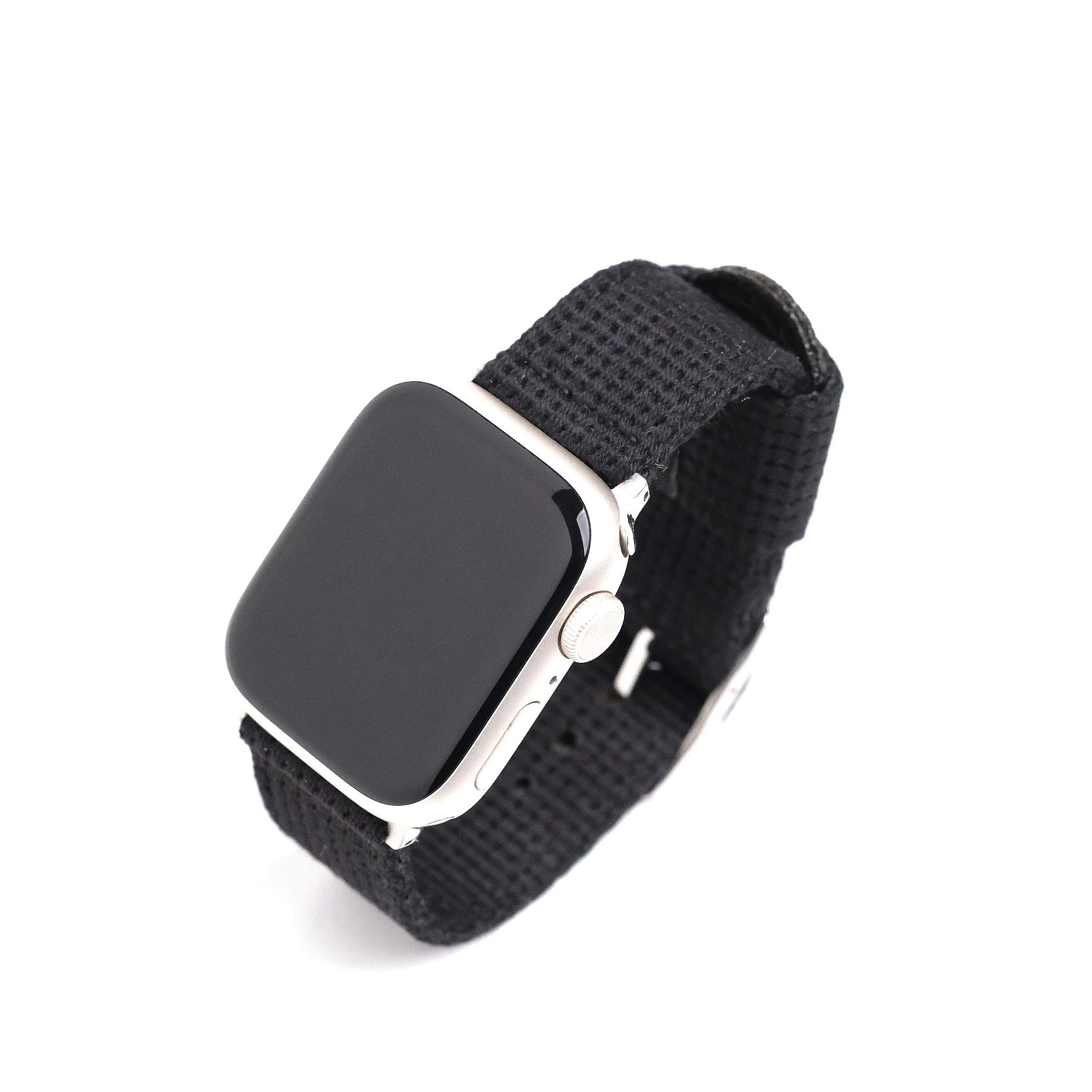 A silver smartwatch with the RSM Watch Strap Vintage Military 2-Piece Watch Strap in Steel and a black, polycotton band is displayed at an angle on a white background, highlighting its side button and digital crown. Compatible with Apple Watch.