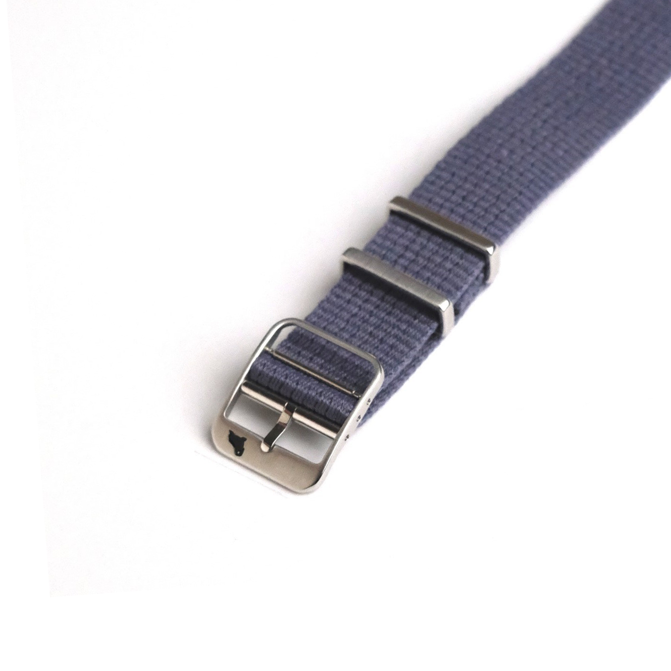 Close-up of VTG Mil in Blue by RSM Watch Strap, featuring a woven fabric, stainless steel buckle, and two metal loops on white.