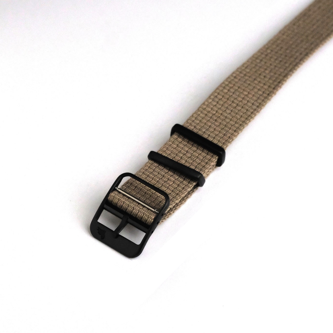 The beige VTG Mil in Khaki by RSM features a stainless steel buckle, two black loops, and is displayed on a white background.