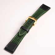 The RSM Watch Strap Art Deco Silk Watch Strap in Green features a gold buckle, textured leaf pattern, black leather ends, and is Apple Watch-compatible, shown on a white background.