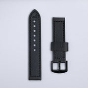 Two RSM Watch Strap “The Leather Watch Strap in Black” straps are shown side by side on a light gray background—one with adjustment holes, the other with a black metal buckle.