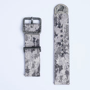 The RSM Watch Strap Snow Camo 2-Piece features a jacquard-woven gray and black camouflage design with metal buckle and tip engraved with an animal, shown on a white background.