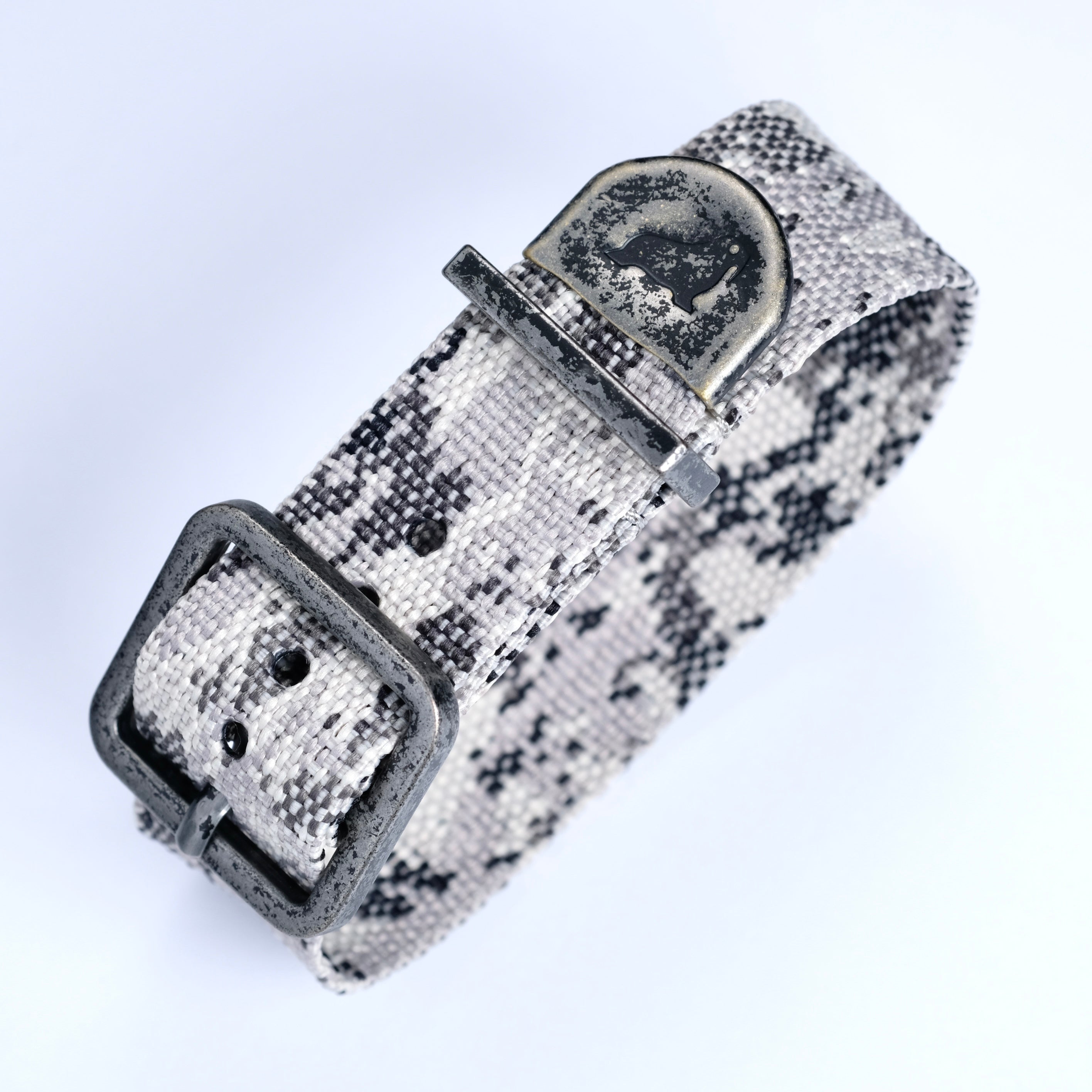 The RSM Watch Strap Snow Camo Zulu is a black and white polyester watch strap featuring a durable monochrome camouflage design.