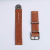 Two RSM Watch Strap Distressed Leather Watch Straps in brown, featuring silver hardware, lie side by side on a white background; one displays holes and a metal tip, the other features a buckle.