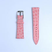 Two pieces of the RSM Watch Strap’s Alligator Circular Grain Calf Leather Watch Strap in Pink are displayed on a white background; the left has a silver buckle, and the right features several adjustment holes.