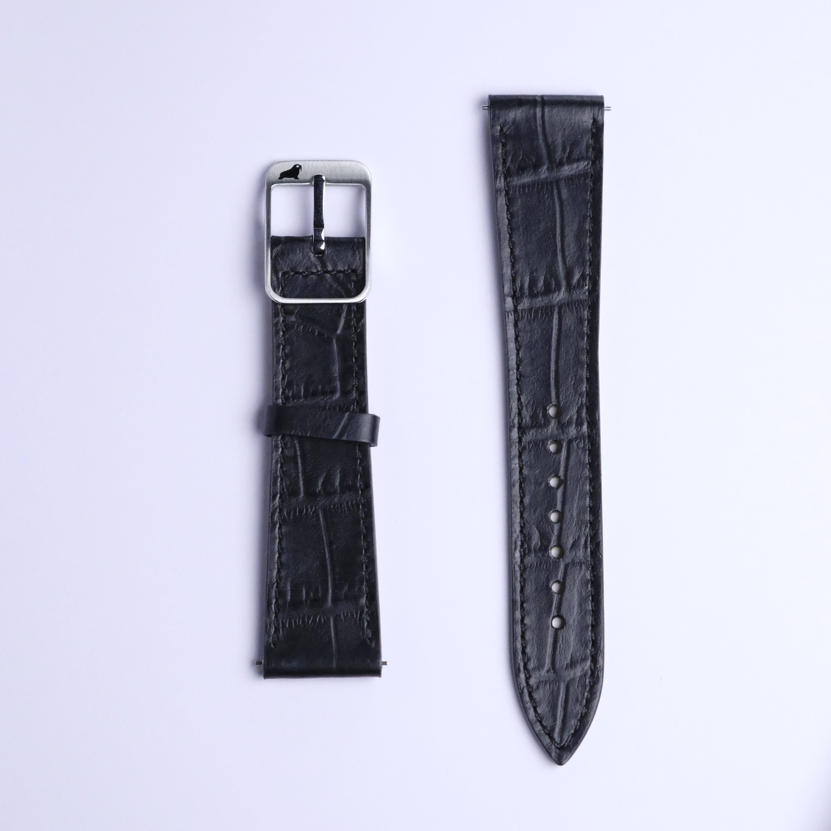 Two RSM Watch Strap Alligator Grain Calf Leather Watch Straps in Black are side by side on a white background—the left with a silver buckle, the right showing multiple adjustment holes.