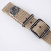 RSM Vintage Military 2-Piece Khaki strap features a textured beige canvas, metal buckle, distressed hardware, and engraved detail.