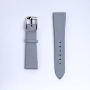 Two pieces of the Fine Canvas Watch Strap in Metallic Blue by RSM Watch Strap are shown side by side on a white background. The left piece has a silver buckle; the right features holes and quick release spring bars for easy adjustment.