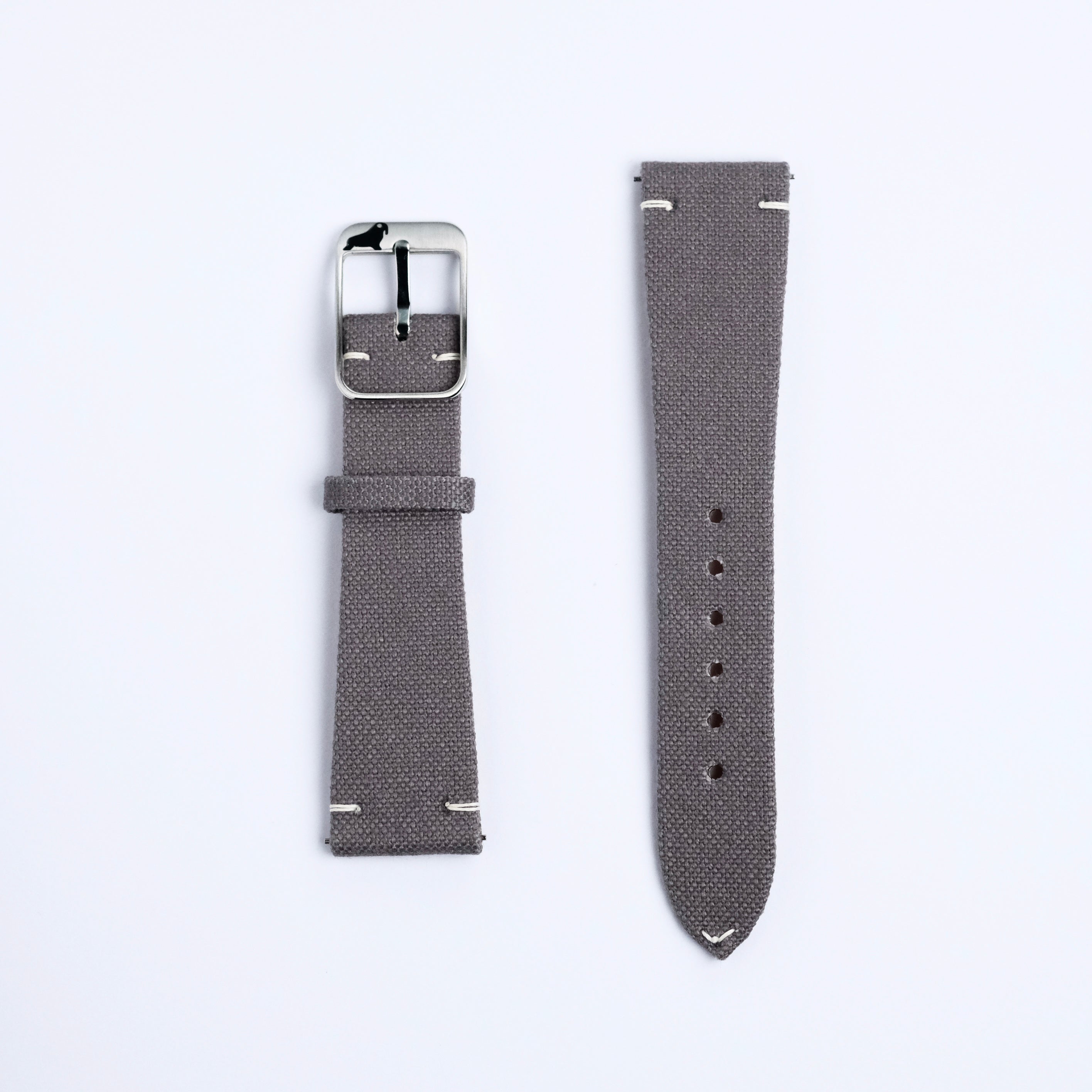 Two Fine Canvas Watch Strap pieces in Mid Grey by RSM Watch Strap are shown side by side on a white background—one with a silver buckle, the other with multiple adjustment holes and both featuring white stitching.