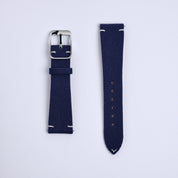 Two Fine Canvas Watch Straps in Navy Blue by RSM Watch Strap are shown side by side on a light background. One features a silver buckle, the other adjustment holes; both have white stitching at the ends.