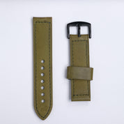 The Leather Watch Strap in Green by RSM Watch Strap features a black buckle and comes in two pieces—one with adjustment holes, the other with a loop and buckle—displayed on a white background.