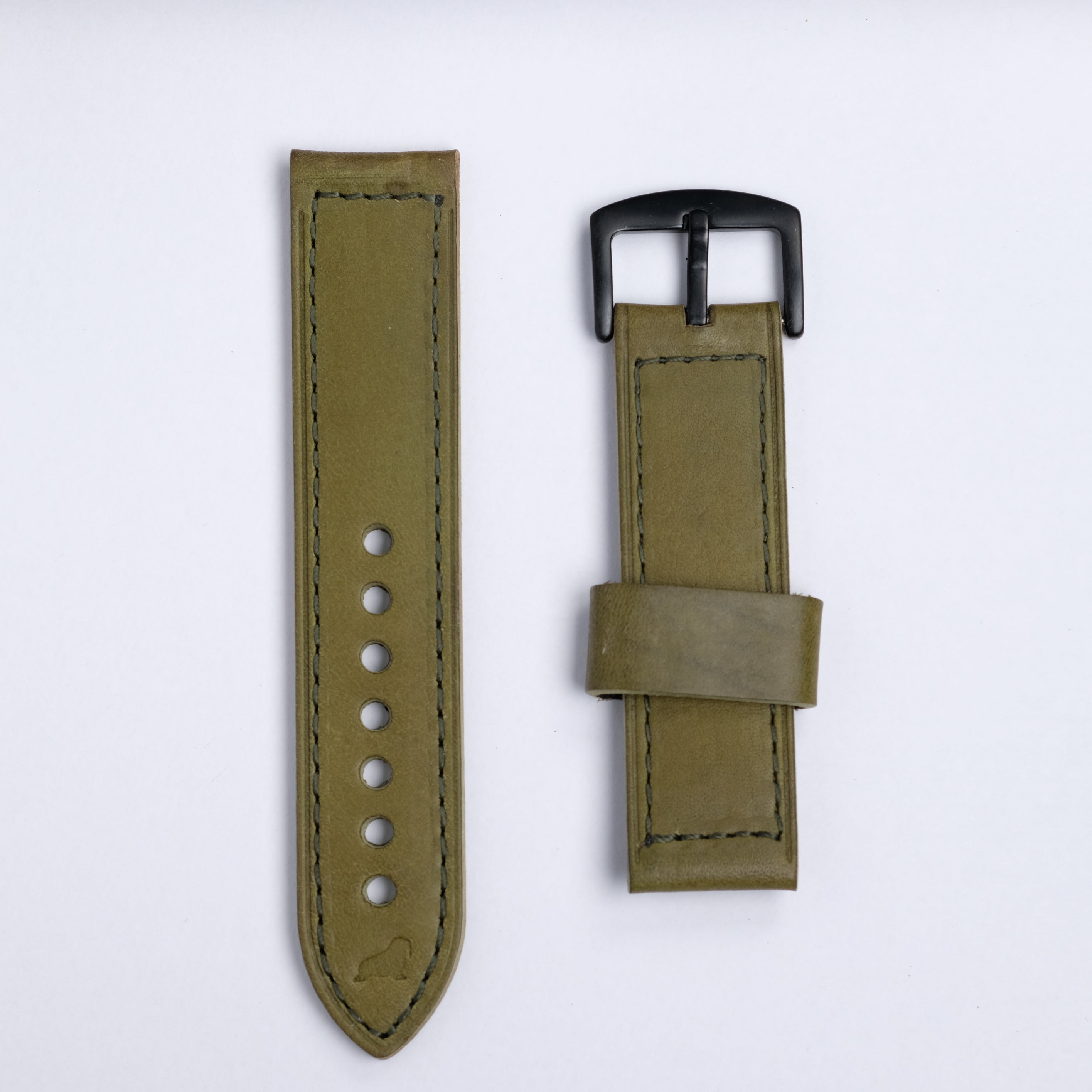 The Leather Watch Strap in Green by RSM Watch Strap features a black buckle and comes in two pieces—one with adjustment holes, the other with a loop and buckle—displayed on a white background.