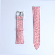Two pieces of the RSM Watch Strap Curved Lugs Alligator Circular Grain Watch Strap in Pink, featuring Japanese craftsmanship, are shown side by side—one with a silver buckle and one with adjustment holes—on a white background.