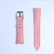 Two pieces of the RSM Watch Strap Curved Lugs Alligator Rectangular Grain Watch Strap in Pink—one with a silver buckle, the other with adjustment holes—are shown side by side on a white background.