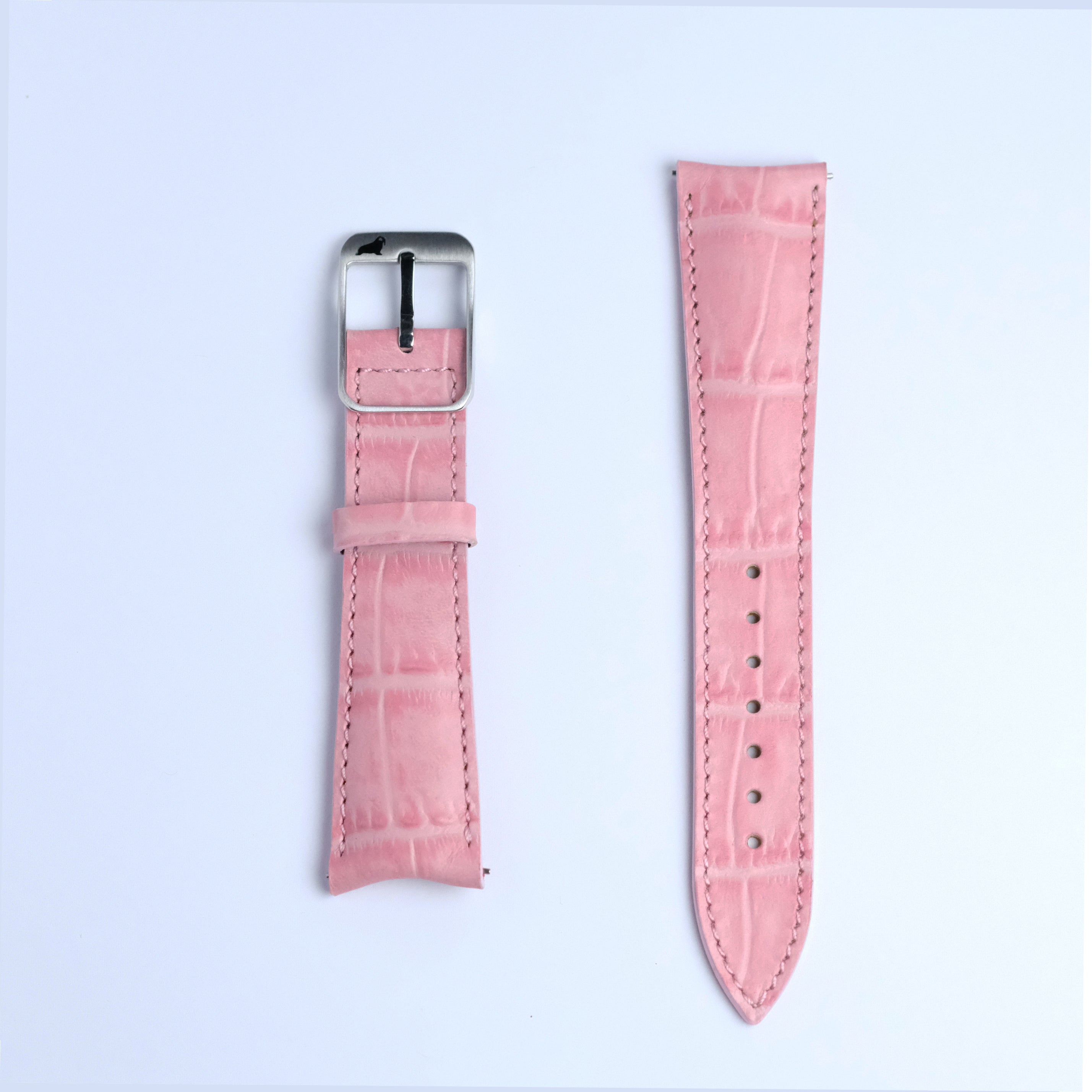 Two pieces of the RSM Watch Strap Curved Lugs Alligator Rectangular Grain Watch Strap in Pink—one with a silver buckle, the other with adjustment holes—are shown side by side on a white background.