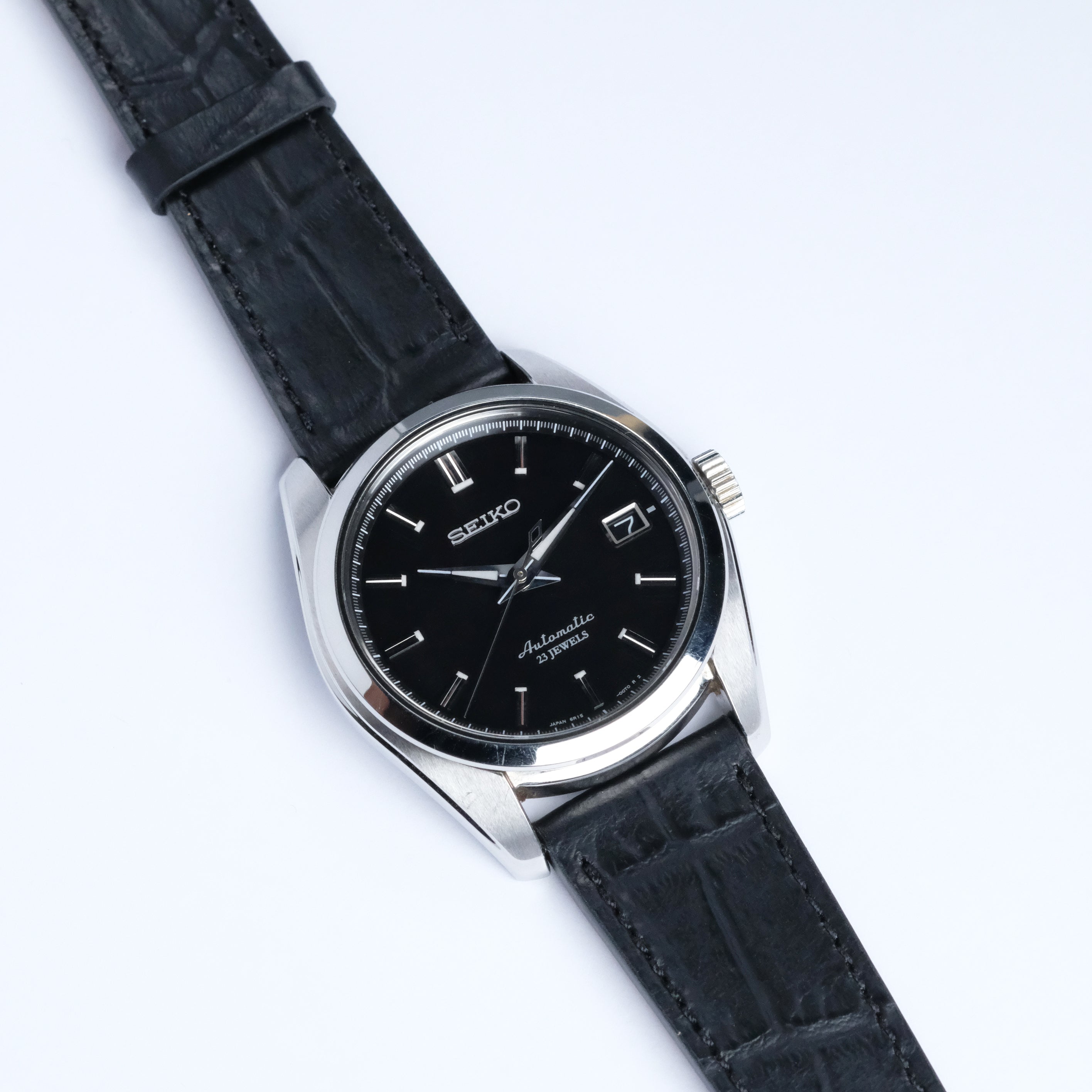 The RSM Watch Strap Alligator Grain Calf Leather Watch Strap in Black is displayed on a white background, featuring a refined texture that highlights the brand’s commitment to craftsmanship.