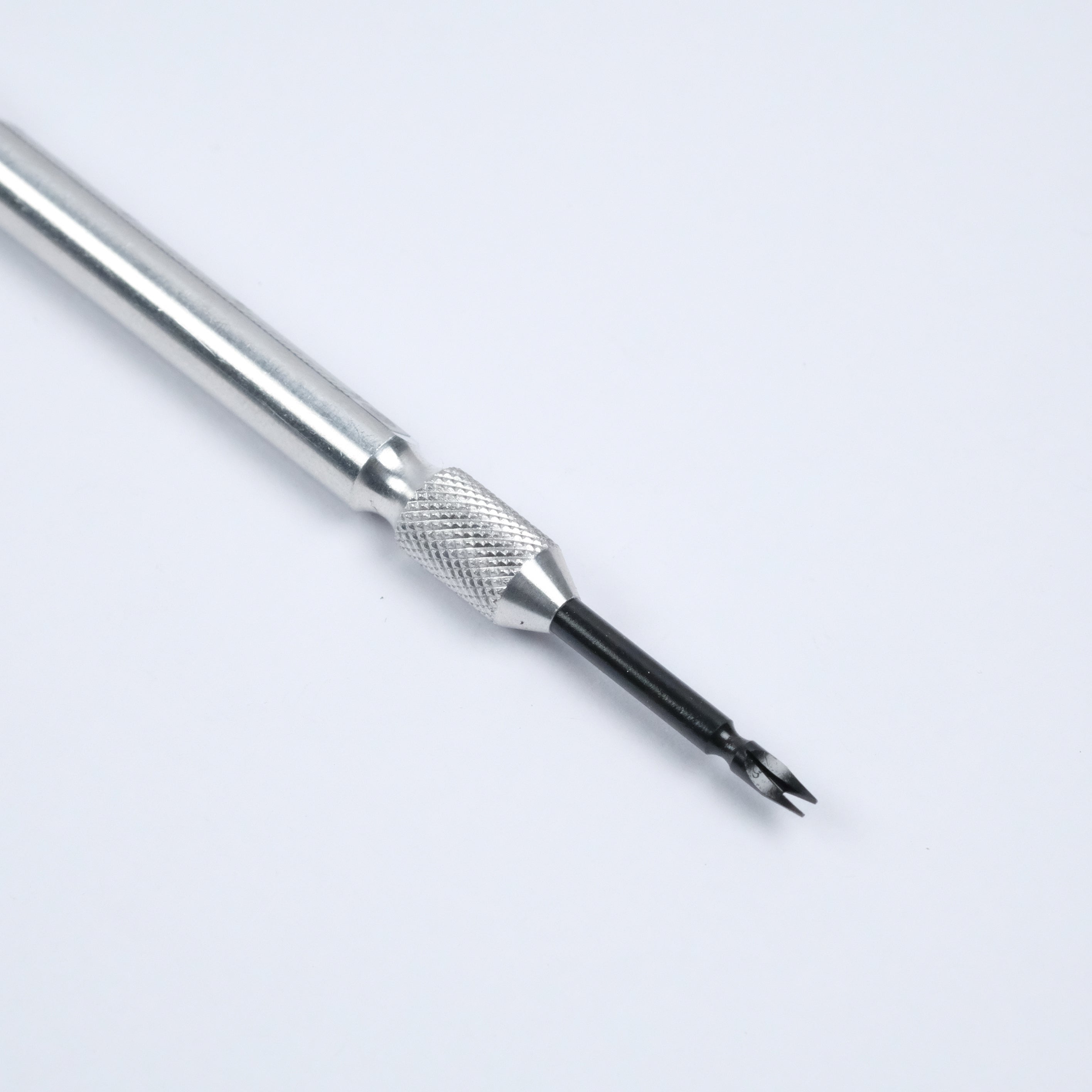 A close-up of the RSM Watch Strap Spring Bar Tool, featuring a textured grip and a small black forked tip, perfect for changing watch straps, displayed on a white background. This precise instrument is made in Japan.