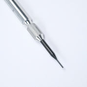A close-up of the RSM Watch Strap Spring Bar Tool, featuring a textured grip and a slender black blade on a white background—perfect for watch strap changes and crafted in Japan for assured quality.