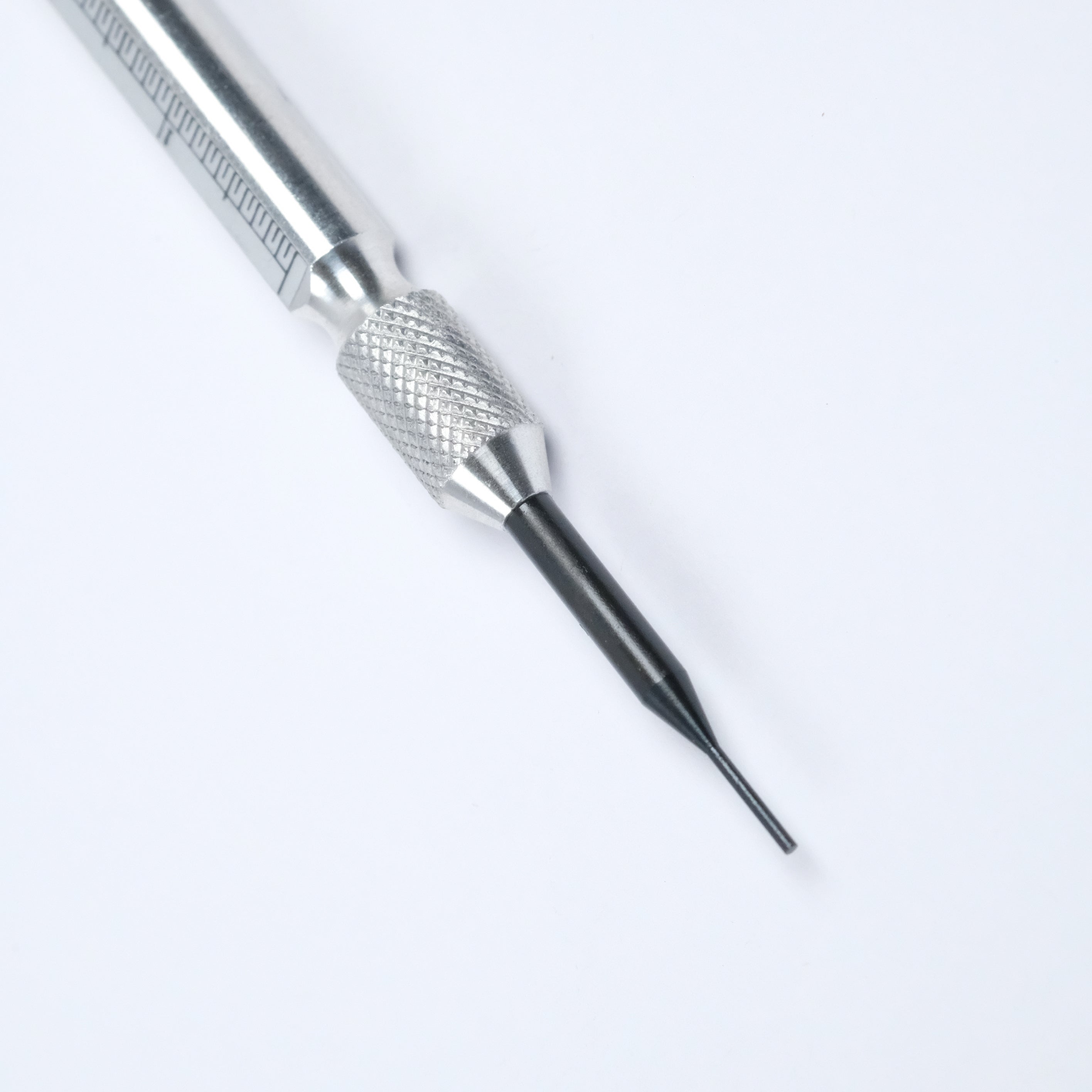 A close-up of the RSM Watch Strap Spring Bar Tool, featuring a textured grip and a slender black blade on a white background—perfect for watch strap changes and crafted in Japan for assured quality.