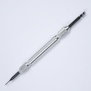 The RSM Watch Strap Spring Bar Tool is a metal accessory with a textured grip, featuring a sharp pointed tip on one end and a forked prong on the other for easy watch strap changes. Made in Japan, it is showcased against a white background.