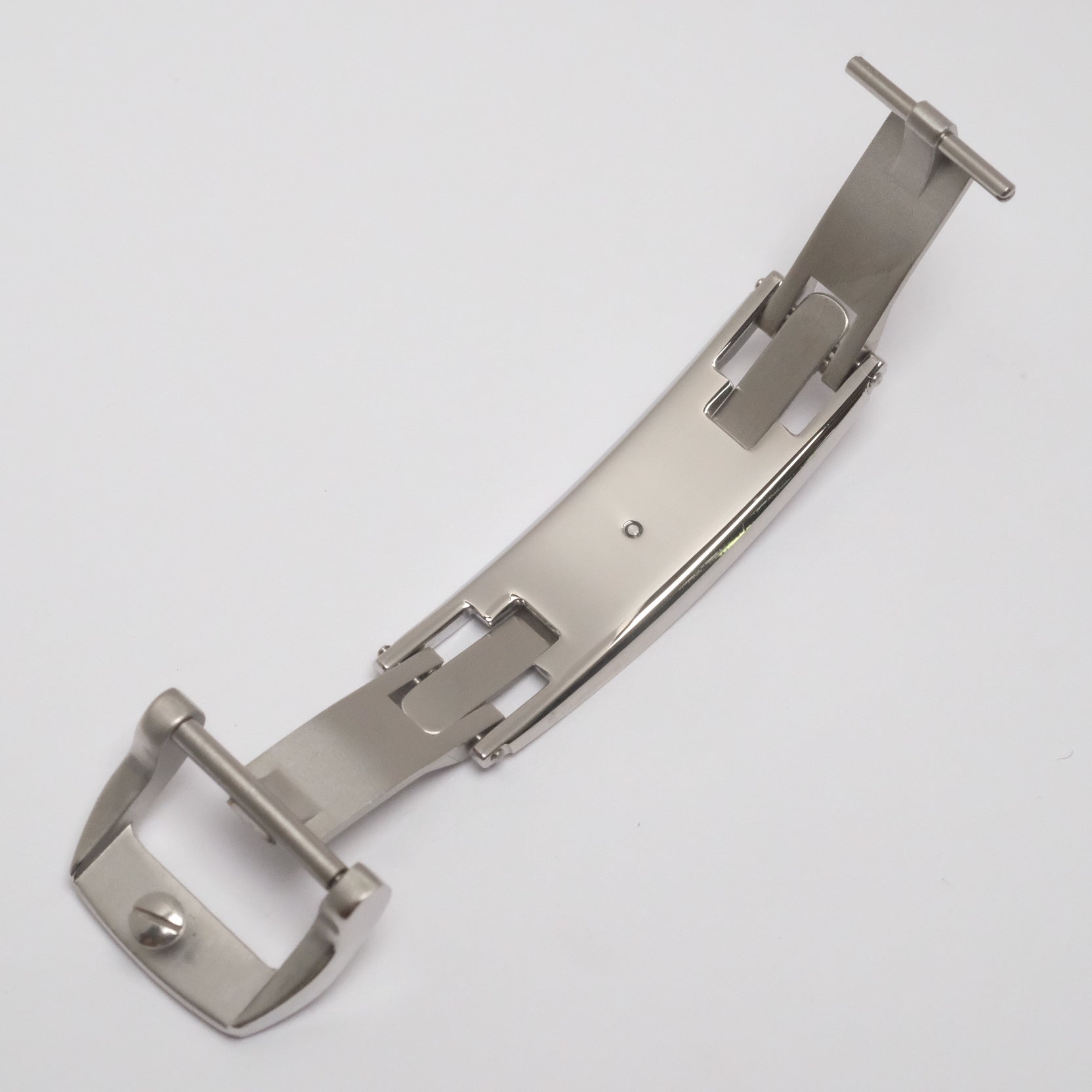 Spring-loaded deployant clasp in the open position, showing the mechanically screwed buckle that holds the watch strap securely in place.