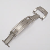 Stainless steel deployant clasp unfolded, showcasing the mechanical strips that secure it in either the 'closed' or 'open' position.