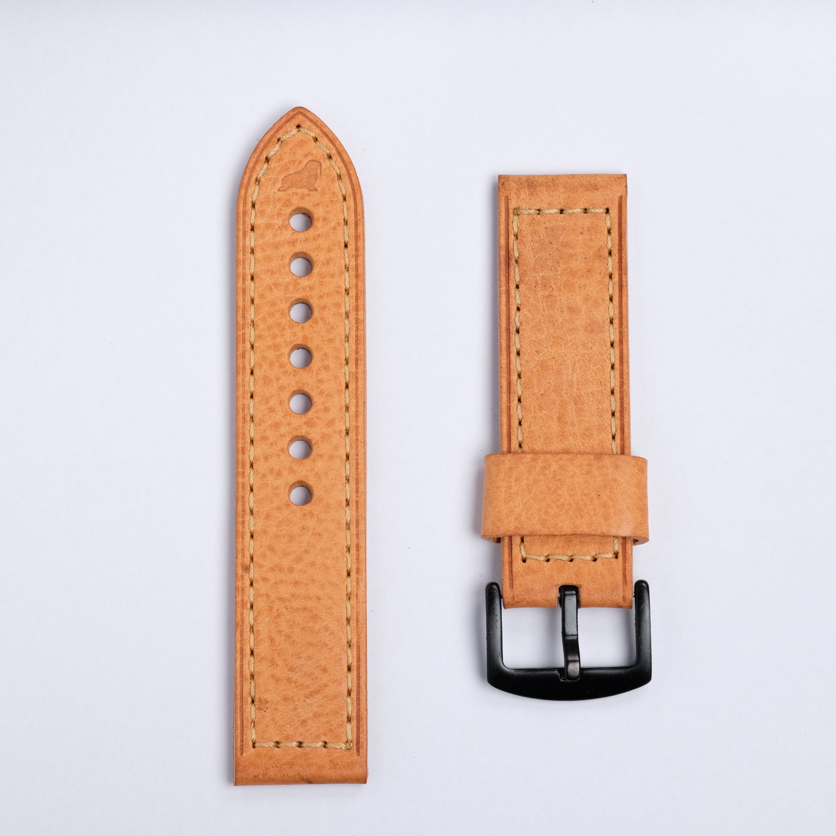 The Leather Watch Strap in Caramel by RSM Watch Strap features visible stitching, a black metal buckle, and multiple holes, shown on a white background—perfect as a complimentary gift.