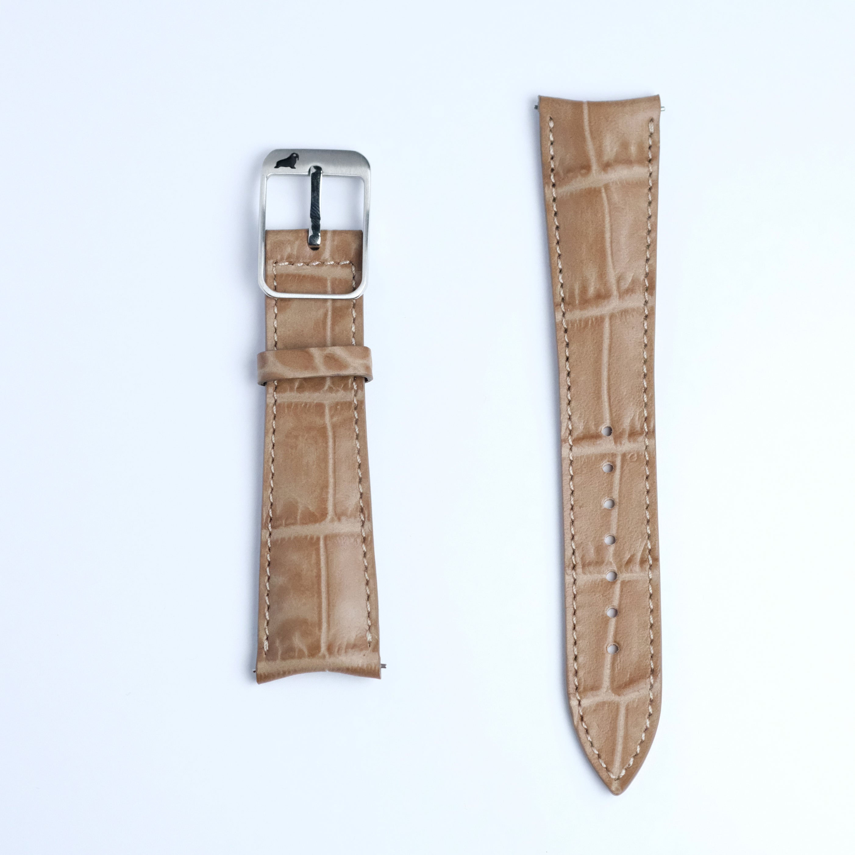 Two pieces of the RSM Watch Strap Curved Lugs Alligator Rectangular Grain in Taupe, featuring a crocodile pattern with white edge stitching and a silver buckle, are shown on a white background.