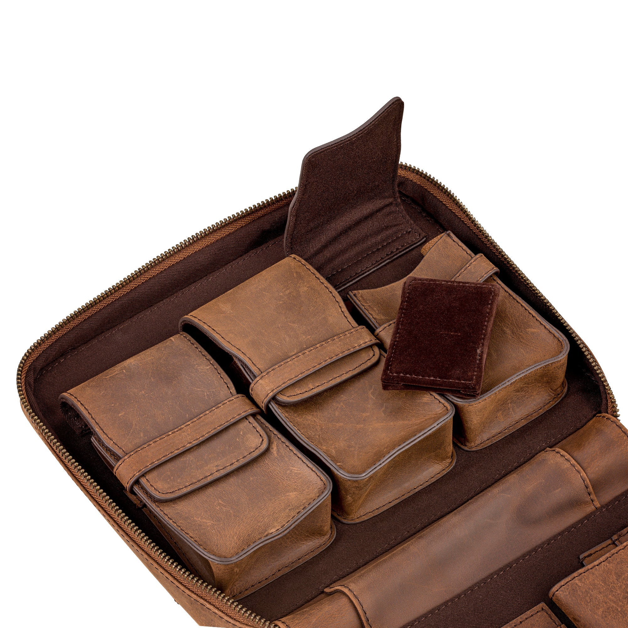 The interior of the 3-Piece Travel Watch Case in Brown Leather by RSM features compartments, small leather pouches, and a velvet pouch for organized storage.
