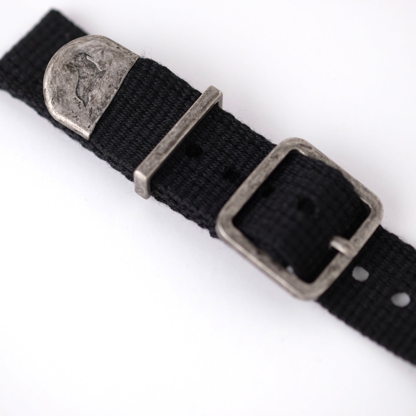 Close-up of RSM Vintage Military 2-Piece (Black) strap with polycotton fabric, distressed metal buckle, keeper, and embossed end cap.