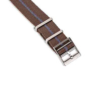 The RSM Engraved Stripe in Blue Coffee features a brown fabric strap with silver loops, a buckle, and blue stitching, placed on a white background.