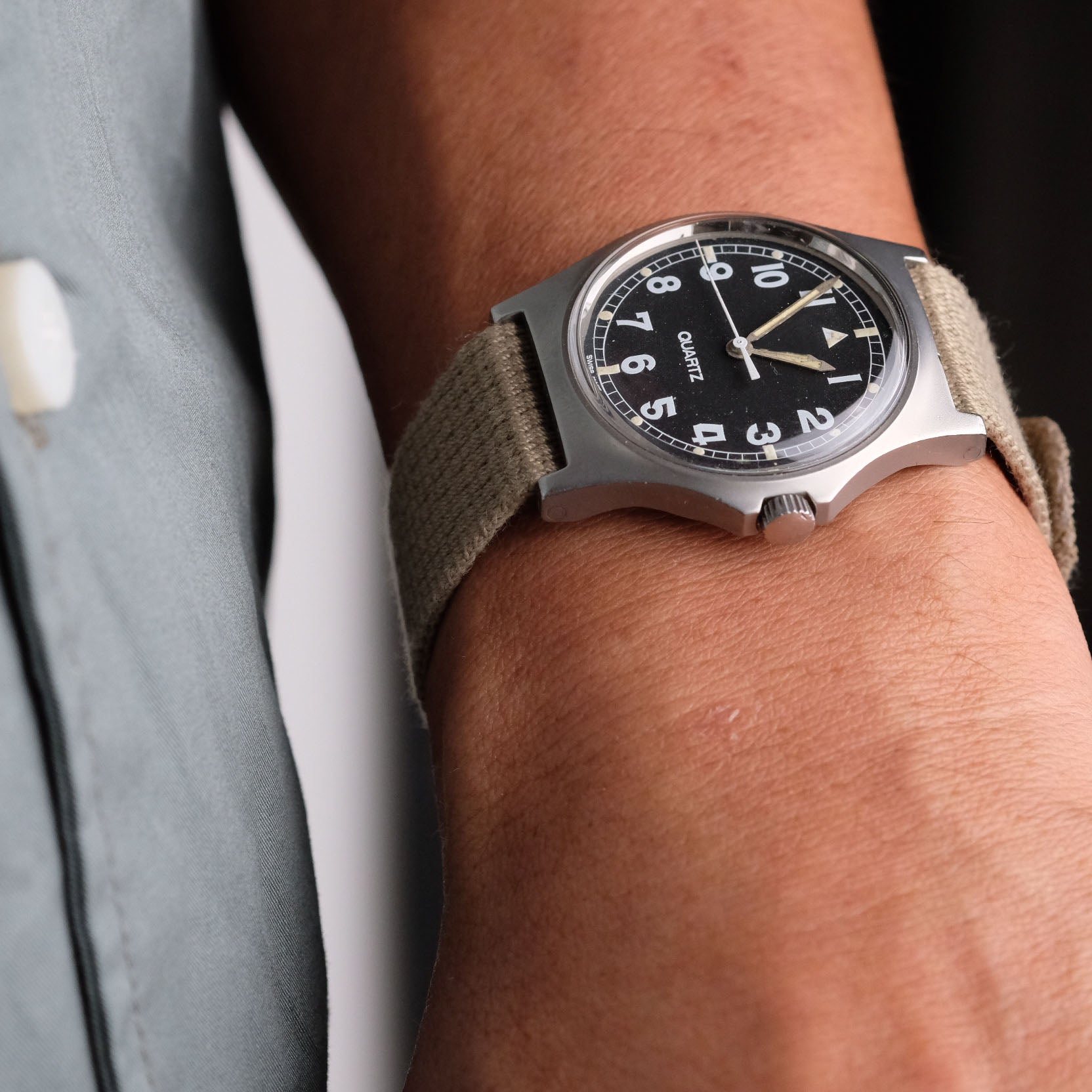A close-up shows the VTG Mil (Khaki) by RSM on a wrist, featuring a CWC G10 with a black dial, white numbers, and a matching khaki strap.