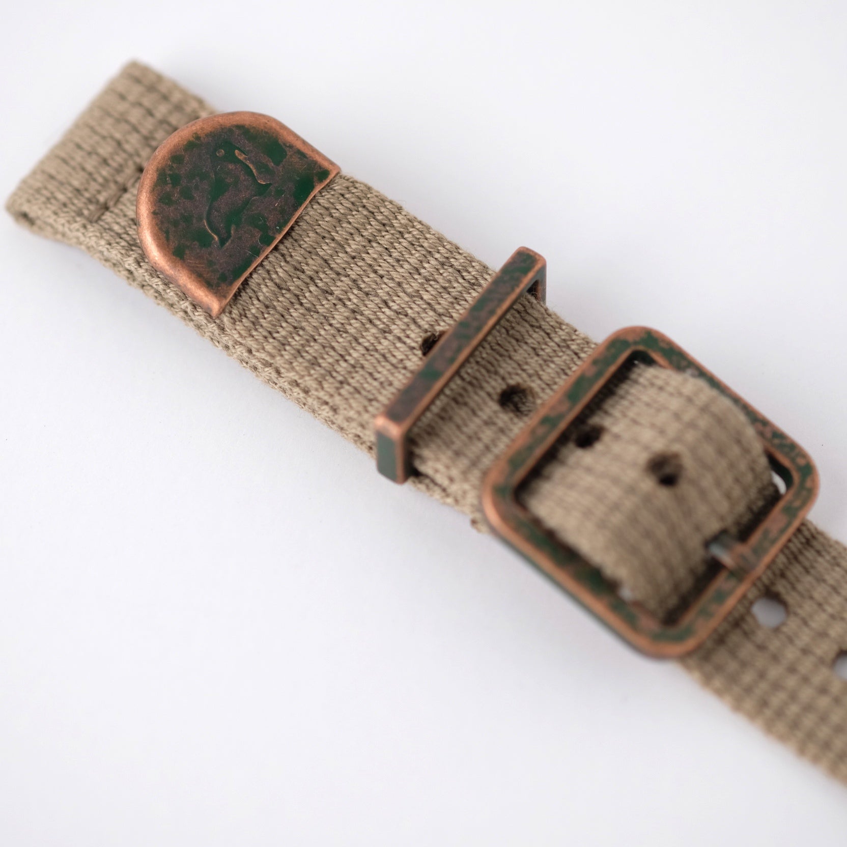 The Vintage Military 2-Piece (Khaki) by RSM features a beige canvas strap with distressed hardware, bronze buckle, and clasp on white.